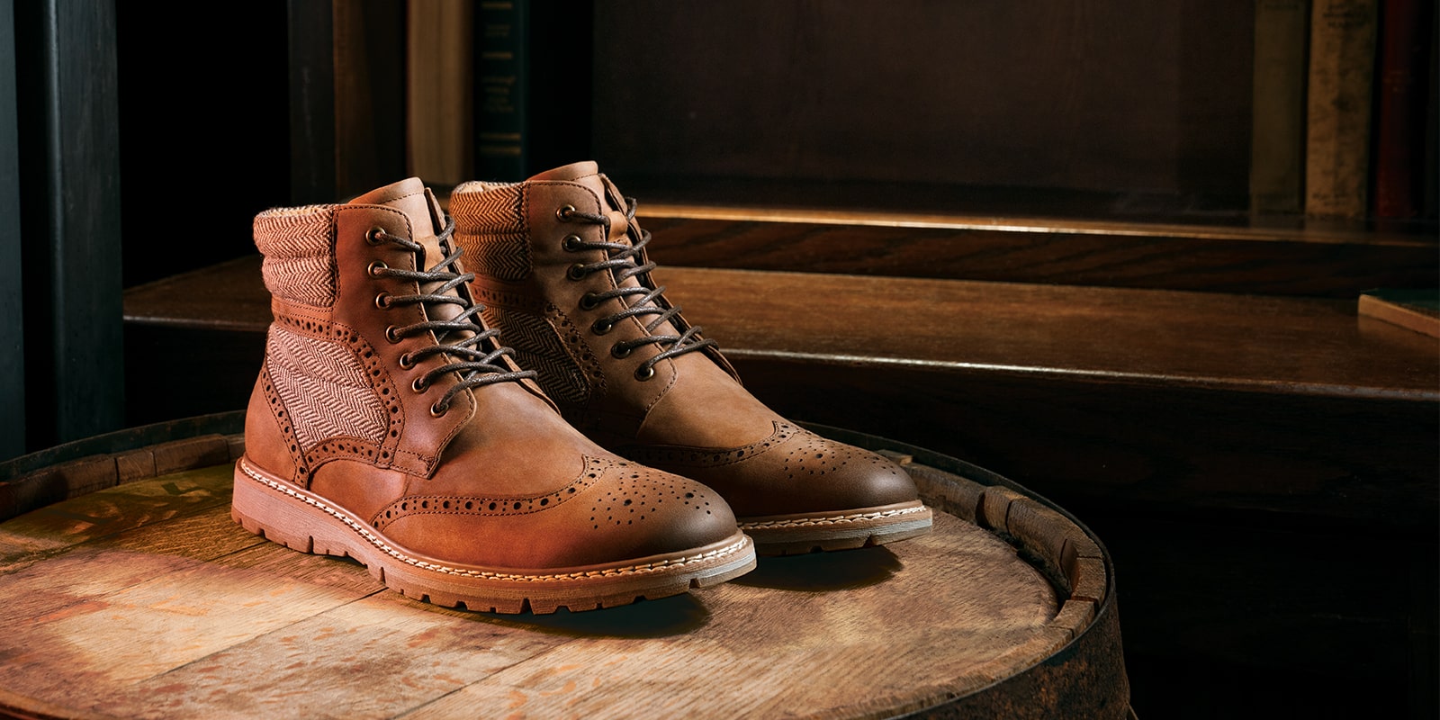 The featured product is the Granger Wingtip Lace Boot in Brown Crazy Horse.